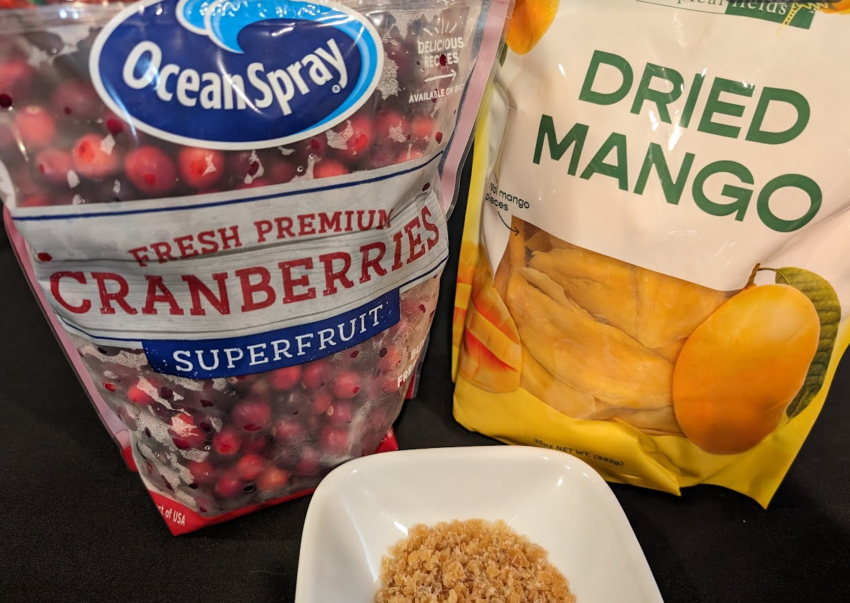 bag of cranberries, bag of dried mango, bowl of candied ginger
